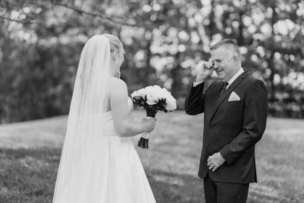Bride's father emotional before the ceremony, captured candidly by a Toronto wedding photographer.